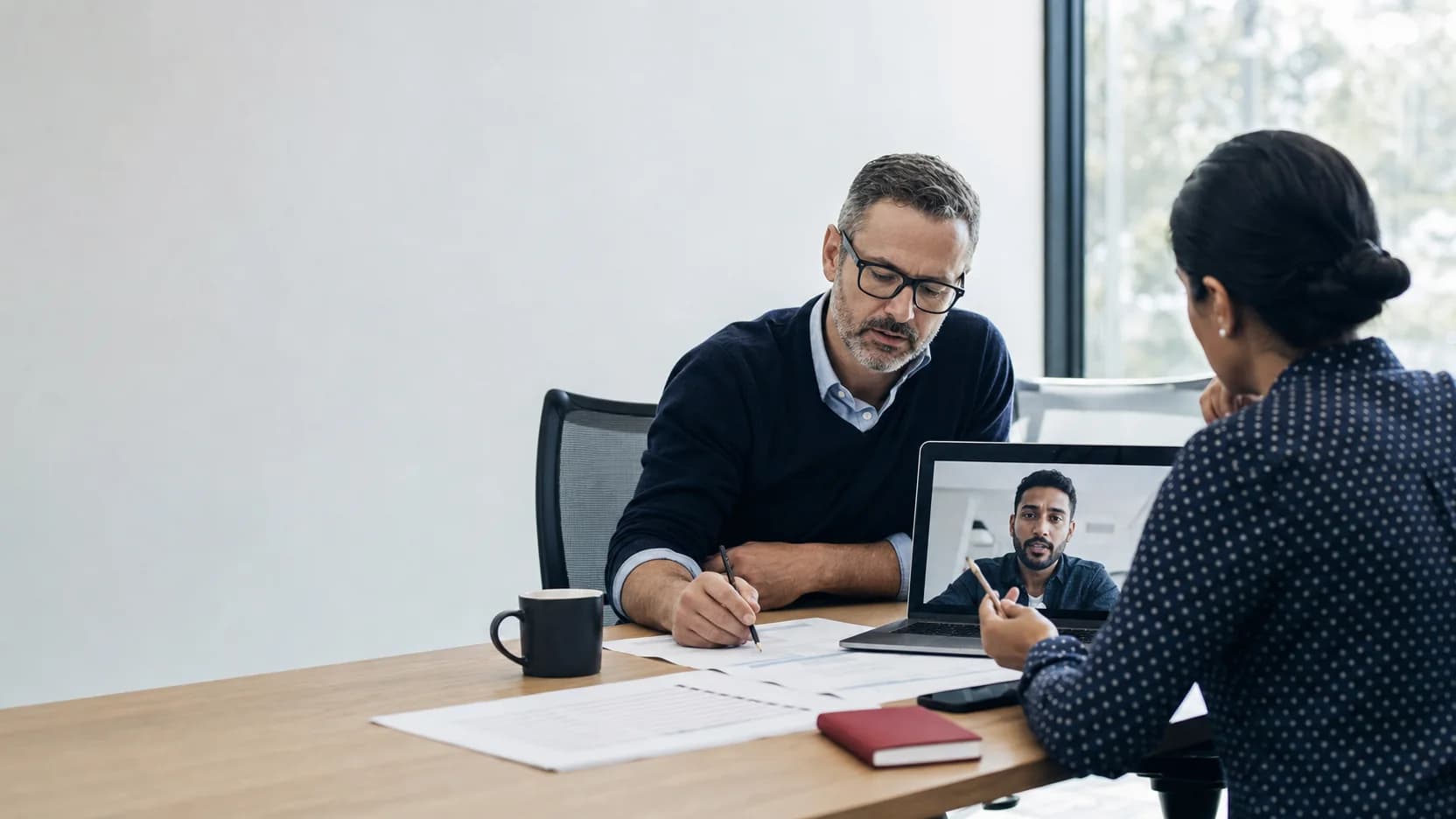 Technology leaders reviewing a release plan with a remote engineer